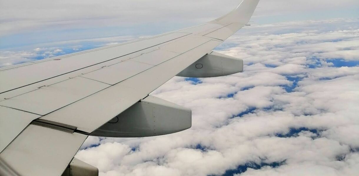 The clouds below the plane wing